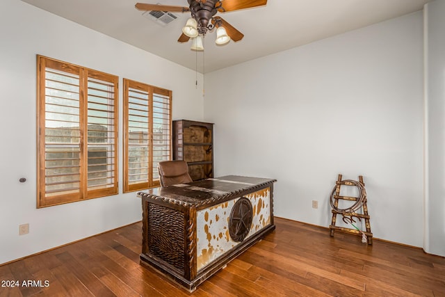 bedroom with visible vents and hardwood / wood-style floors
