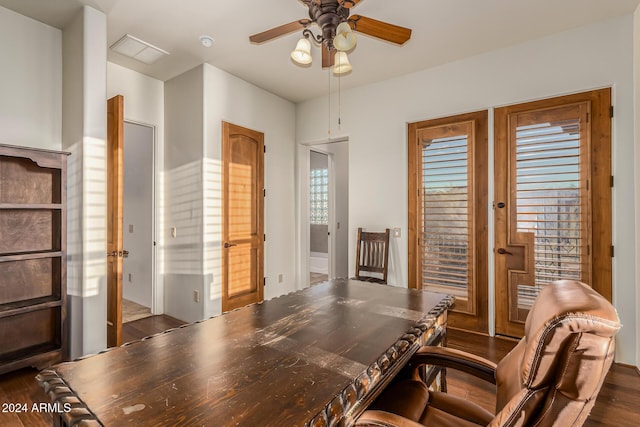 home office with a ceiling fan, dark wood-style floors, and visible vents
