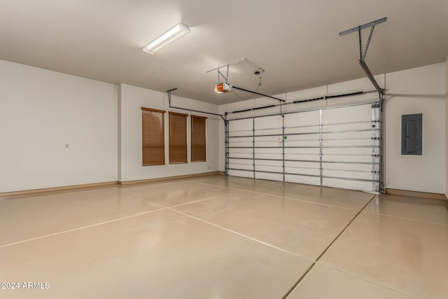 garage featuring a garage door opener and electric panel