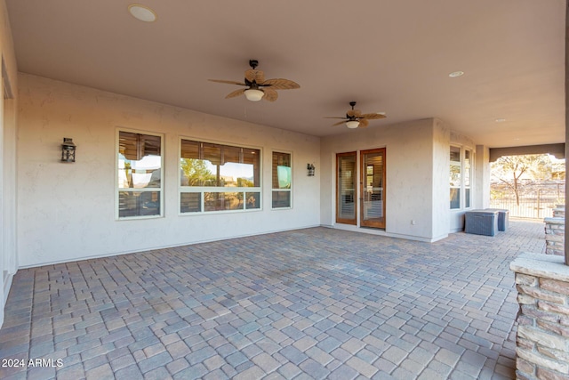 view of patio / terrace with ceiling fan and fence