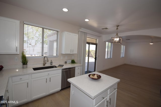 28377 N Desert Native St, San Tan Valley, AZ 85143 - kitchen featuring stainless steel dishwasher, light wood-type flooring, white cabinetry, open floor plan, and pendant lighting
