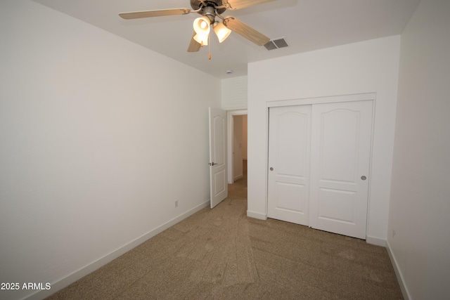 28377 N Desert Native St, San Tan Valley, AZ 85143 - unfurnished bedroom featuring light colored carpet, a closet, and ceiling fan