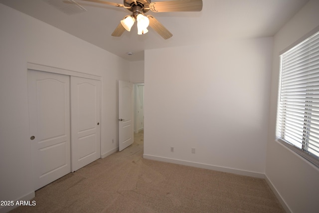 28377 N Desert Native St, San Tan Valley, AZ 85143 - unfurnished bedroom with light carpet, a closet, and a ceiling fan