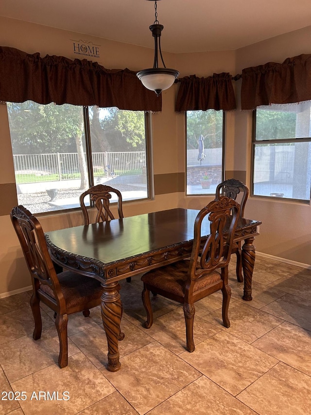 dining space with baseboards