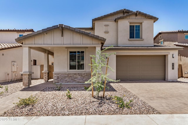 21481 E Sparrow Dr, Queen Creek, AZ 85142 - craftsman inspired home featuring decorative driveway, stone siding, a garage, stucco siding, and board and batten siding