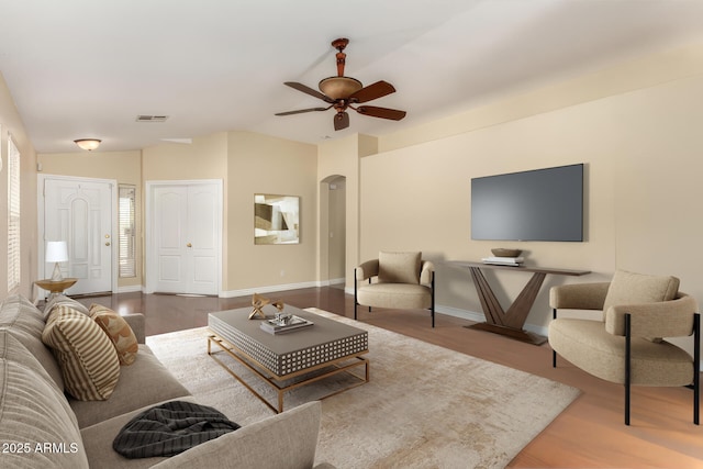 living room with ceiling fan and wood-type flooring