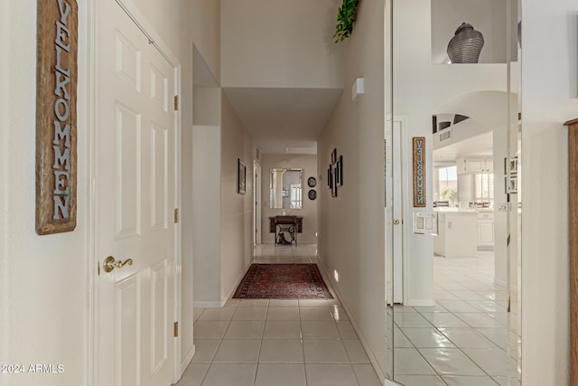 corridor with light tile patterned floors