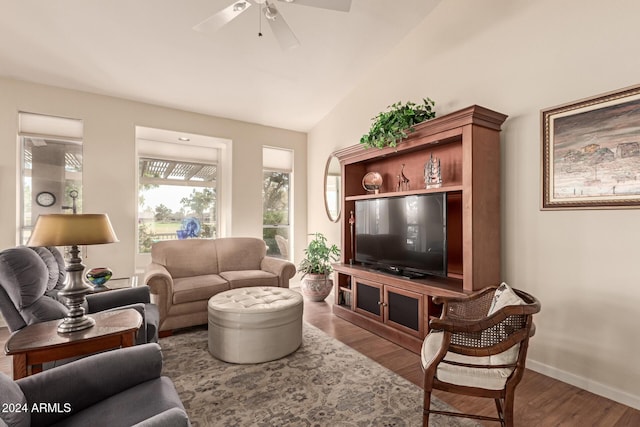 living room with ceiling fan, hardwood / wood-style floors, and lofted ceiling