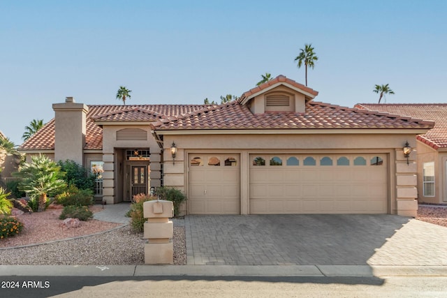 mediterranean / spanish house featuring a garage