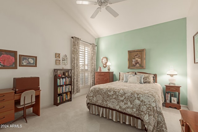 carpeted bedroom featuring ceiling fan and vaulted ceiling