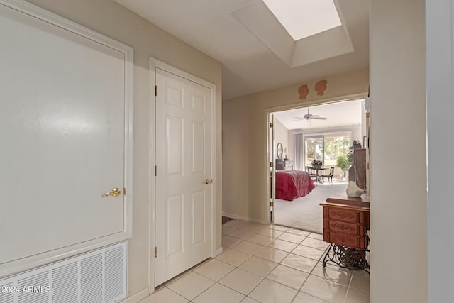 hallway featuring light tile patterned flooring