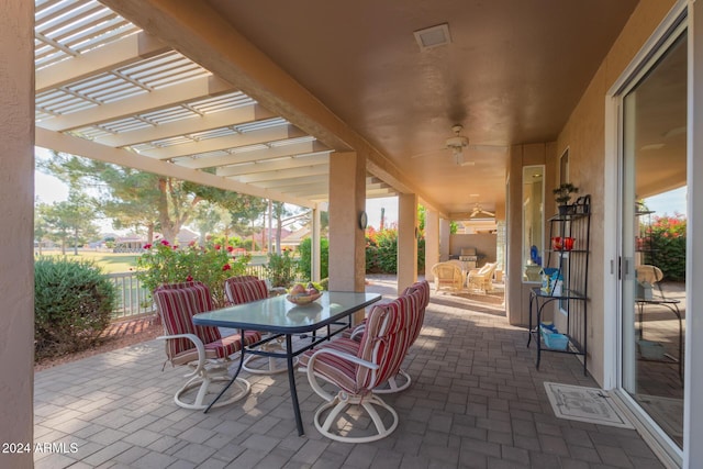 view of patio / terrace featuring a pergola and ceiling fan