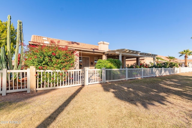 view of front of property with a pergola