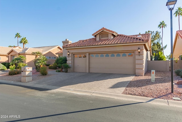 mediterranean / spanish-style house featuring a garage