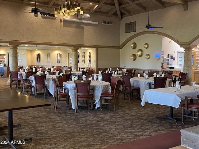 dining space featuring beamed ceiling, high vaulted ceiling, and dark colored carpet