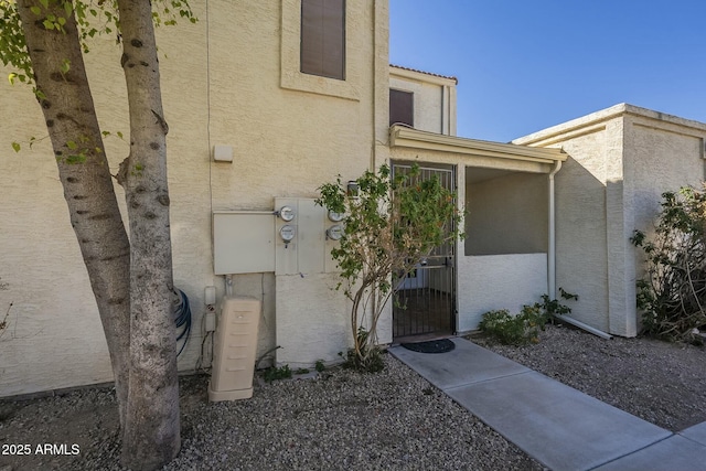 doorway to property with stucco siding