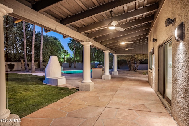 view of patio featuring ceiling fan