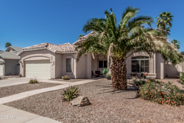 240 W Brooks St, Gilbert, AZ 85233 - mediterranean / spanish house featuring a garage, stucco siding, driveway, and a tile roof