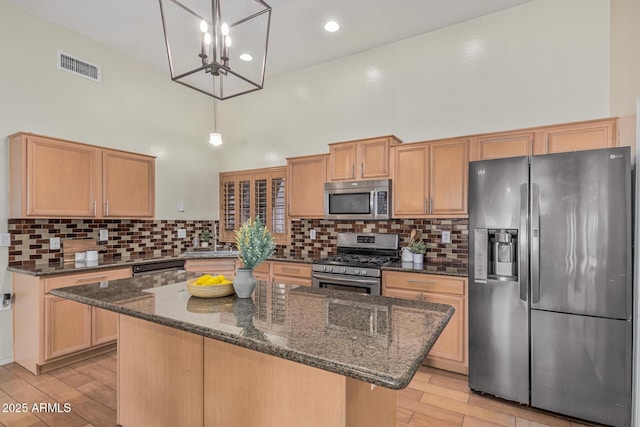 240 W Brooks St, Gilbert, AZ 85233 - kitchen featuring stainless steel appliances, light wood-style floors, visible vents, and a high ceiling