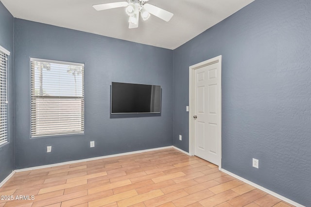 240 W Brooks St, Gilbert, AZ 85233 - spare room with baseboards, a ceiling fan, and wood finished floors