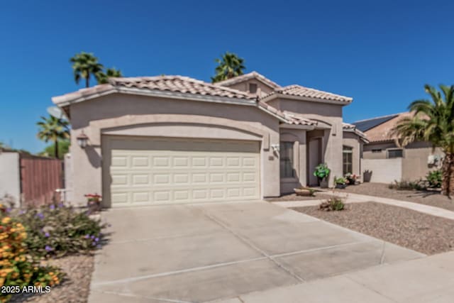 240 W Brooks St, Gilbert, AZ 85233 - mediterranean / spanish house with a garage, a tile roof, fence, stucco siding, and driveway
