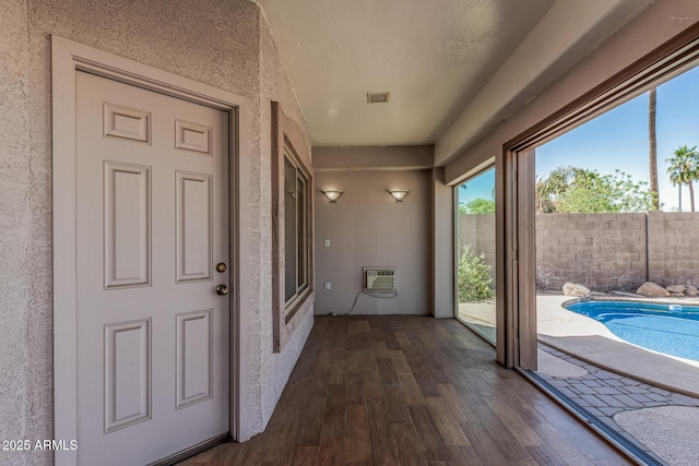 240 W Brooks St, Gilbert, AZ 85233 - interior space with visible vents, a wall mounted AC, and dark wood finished floors