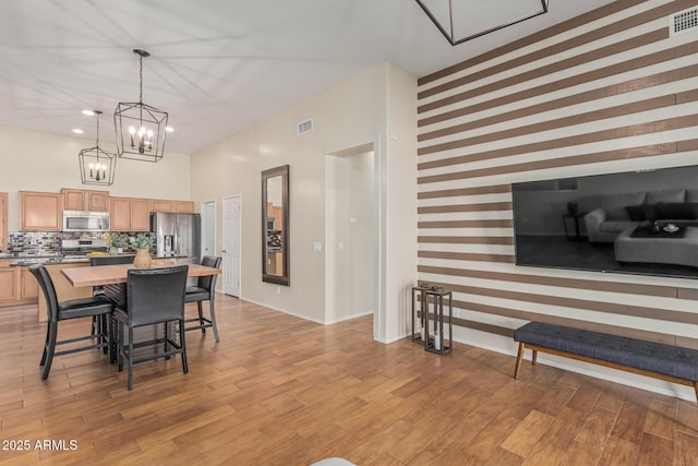 240 W Brooks St, Gilbert, AZ 85233 - dining area with baseboards, wallpapered walls, recessed lighting, light wood-style floors, and visible vents