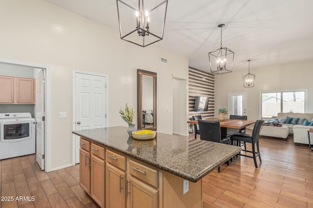 240 W Brooks St, Gilbert, AZ 85233 - kitchen featuring washer / clothes dryer, a chandelier, open floor plan, a kitchen island, and light wood finished floors