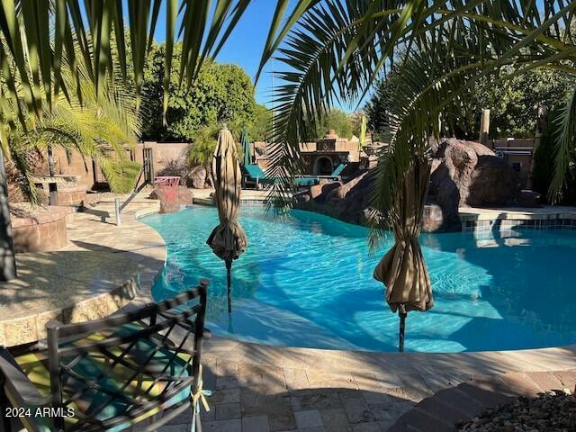 view of swimming pool featuring a patio area