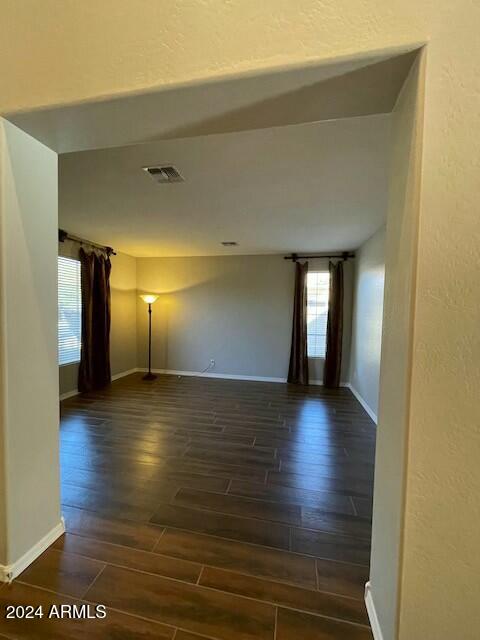 spare room with dark hardwood / wood-style floors