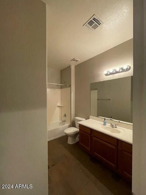 full bathroom featuring tile patterned floors, vanity, toilet, and shower / bath combination