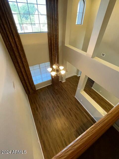 details with a chandelier and wood-type flooring