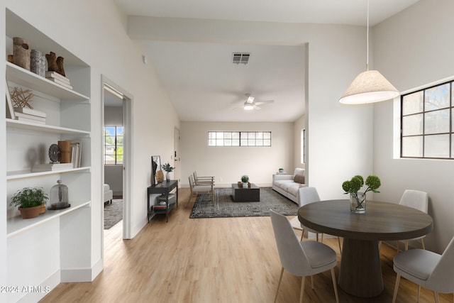 dining space with ceiling fan and light hardwood / wood-style floors