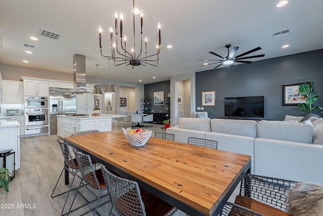 dining room featuring ceiling fan and light hardwood / wood-style flooring