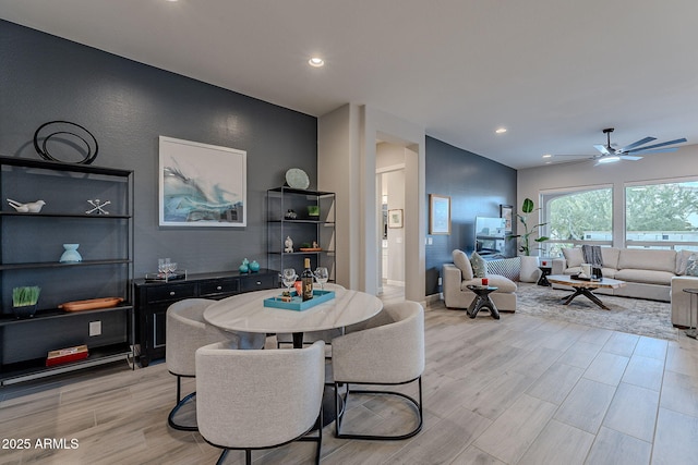 dining area featuring ceiling fan and light hardwood / wood-style flooring