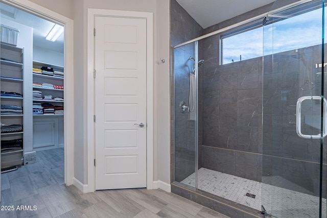 bathroom featuring hardwood / wood-style floors and an enclosed shower