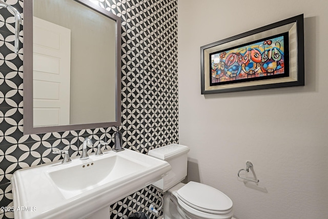 bathroom featuring sink and toilet