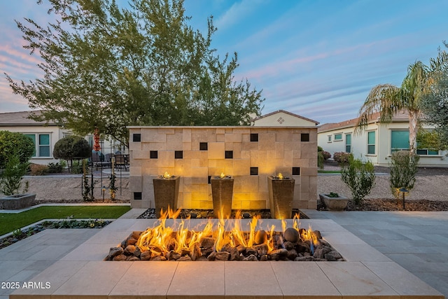 exterior space with a patio and a fire pit