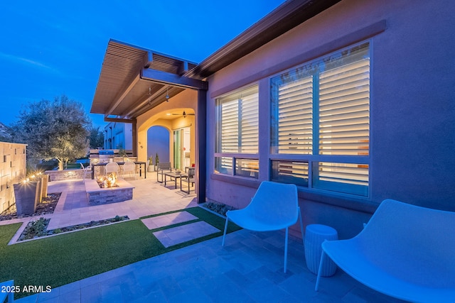 view of patio / terrace with an outdoor fire pit