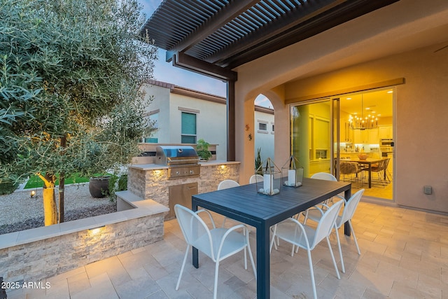 view of patio with a pergola, area for grilling, and exterior kitchen