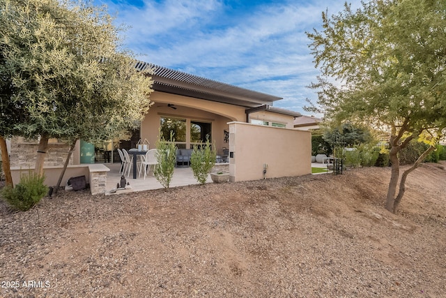 rear view of house featuring a patio area