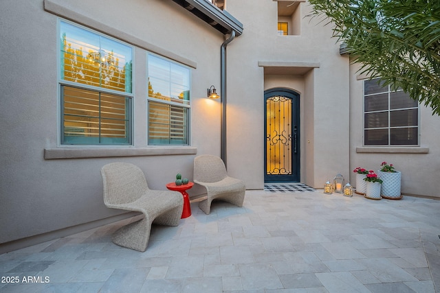 property entrance with a patio