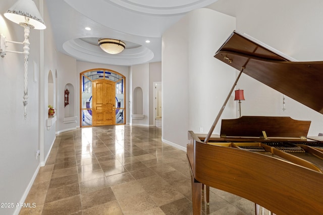 entryway featuring a tray ceiling