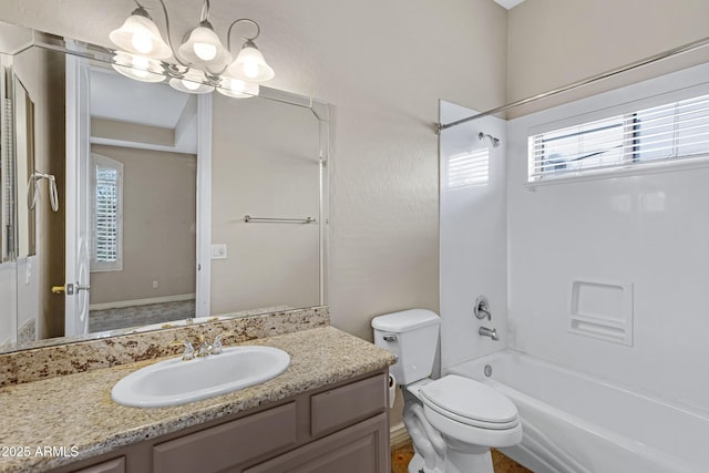 full bathroom featuring vanity, a wealth of natural light,  shower combination, and toilet