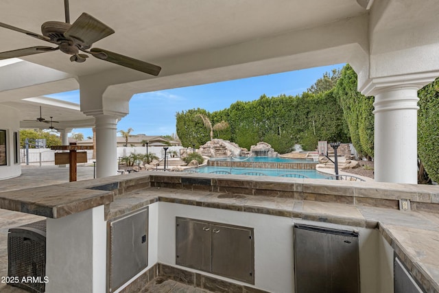 view of patio featuring ceiling fan, a fenced in pool, and area for grilling