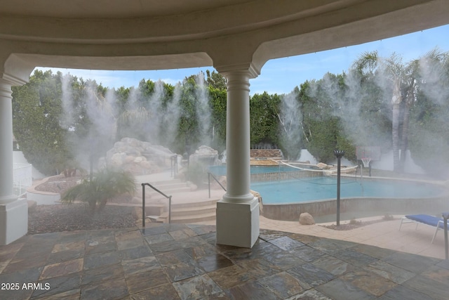 view of pool featuring a patio area