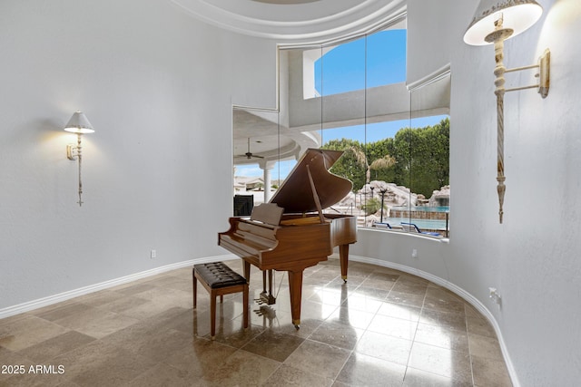 sitting room featuring a towering ceiling