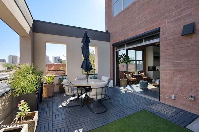 view of patio featuring outdoor dining area