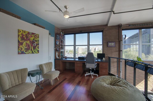 office space with a ceiling fan, dark wood-style floors, and plenty of natural light