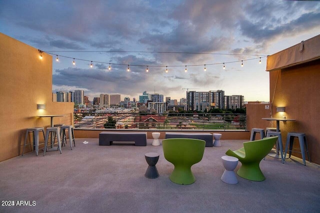 view of patio terrace at dusk